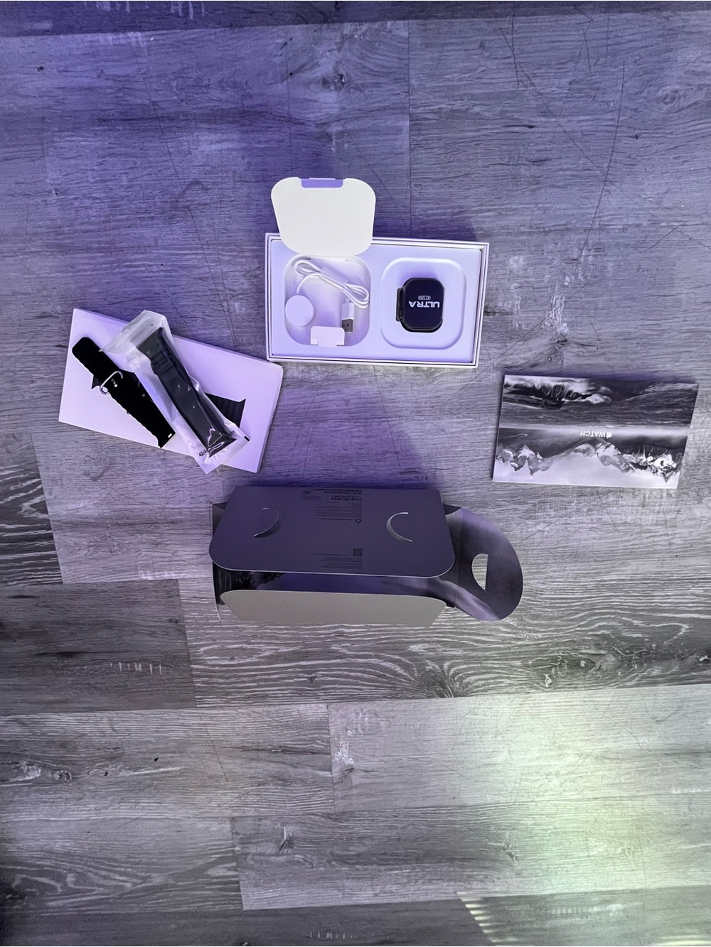 Apple Smartwatch with Black Sport Band and White Charging Dock